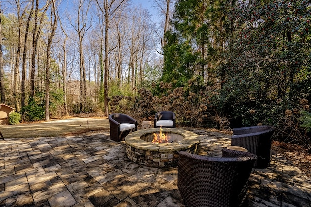 view of patio / terrace featuring a fire pit