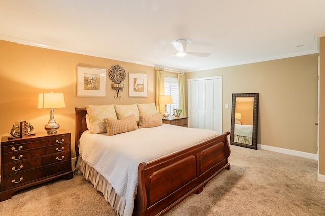 bedroom with crown molding, light colored carpet, a closet, and ceiling fan