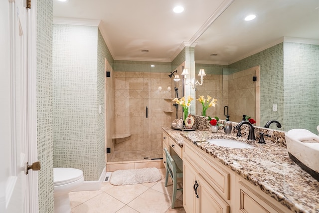 bathroom featuring tile patterned flooring, ornamental molding, vanity, walk in shower, and toilet