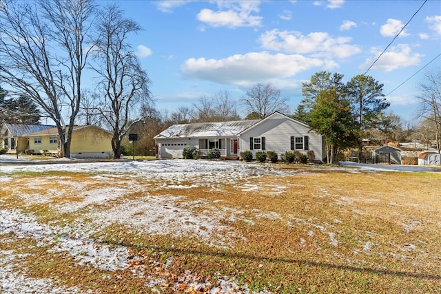 ranch-style house featuring a garage