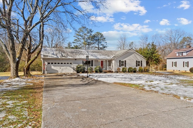 view of front of home with a garage and covered porch