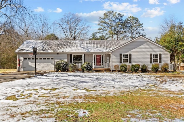 single story home with a garage and covered porch