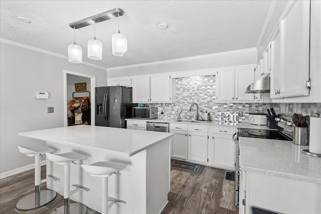 kitchen featuring white cabinetry, decorative light fixtures, a kitchen breakfast bar, and black appliances