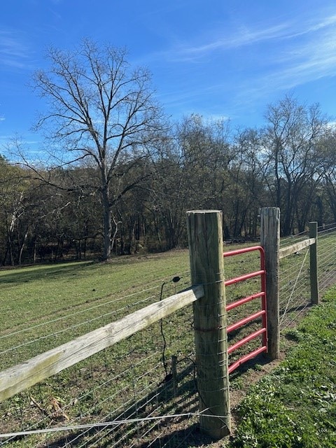 exterior space with a lawn and a rural view