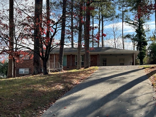 view of front of property featuring a carport