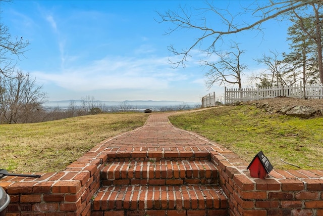 view of property's community with fence