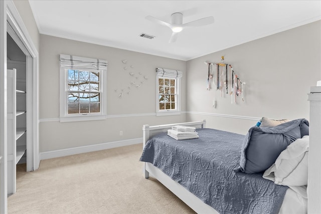 bedroom with visible vents, multiple windows, ornamental molding, and carpet floors