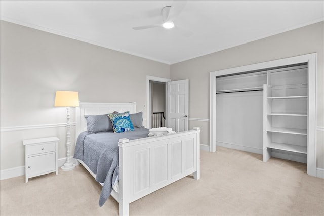 bedroom with crown molding, light colored carpet, baseboards, and ceiling fan