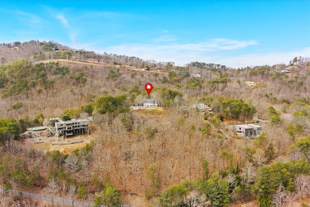 drone / aerial view featuring a view of trees