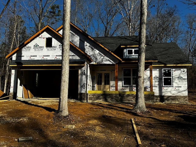 unfinished property with a garage