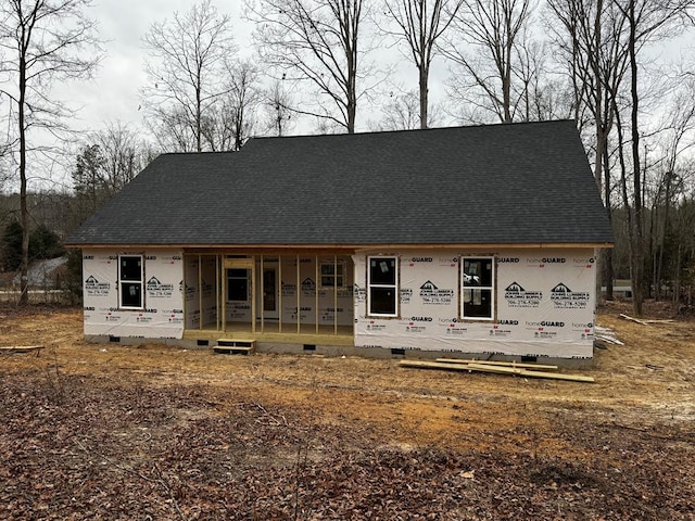 back of property with covered porch