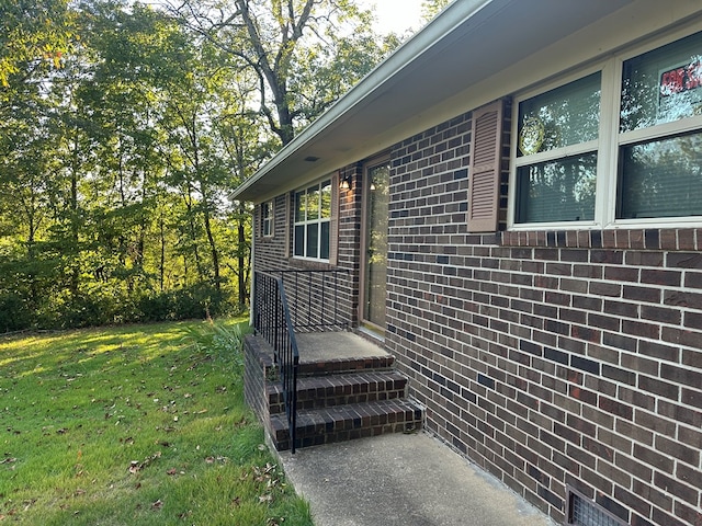 view of home's exterior with a yard