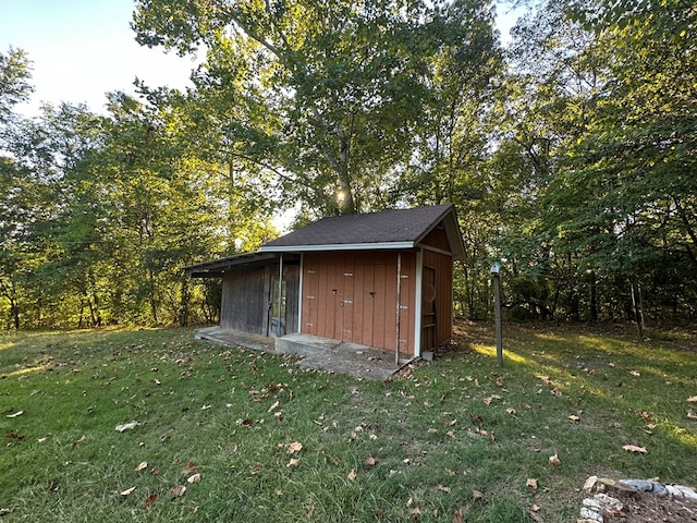 view of outdoor structure with a lawn