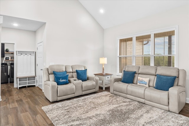 living room featuring hardwood / wood-style floors and high vaulted ceiling