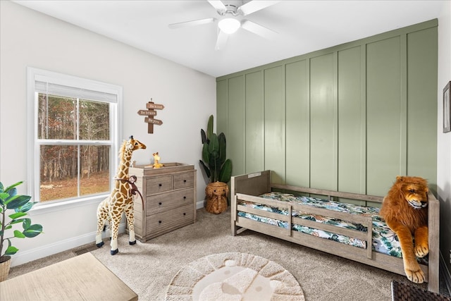 bedroom featuring light colored carpet and ceiling fan