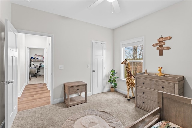 bedroom featuring light colored carpet and ceiling fan