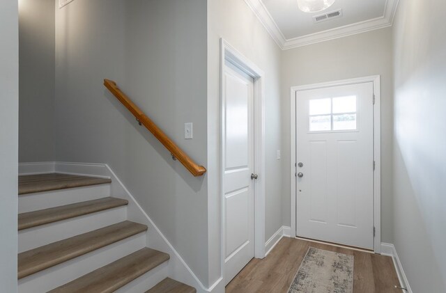 141 Andros Dr, Dalton, GA 30721 - foyer entrance featuring wood finished floors, ornamental molding, and baseboards
