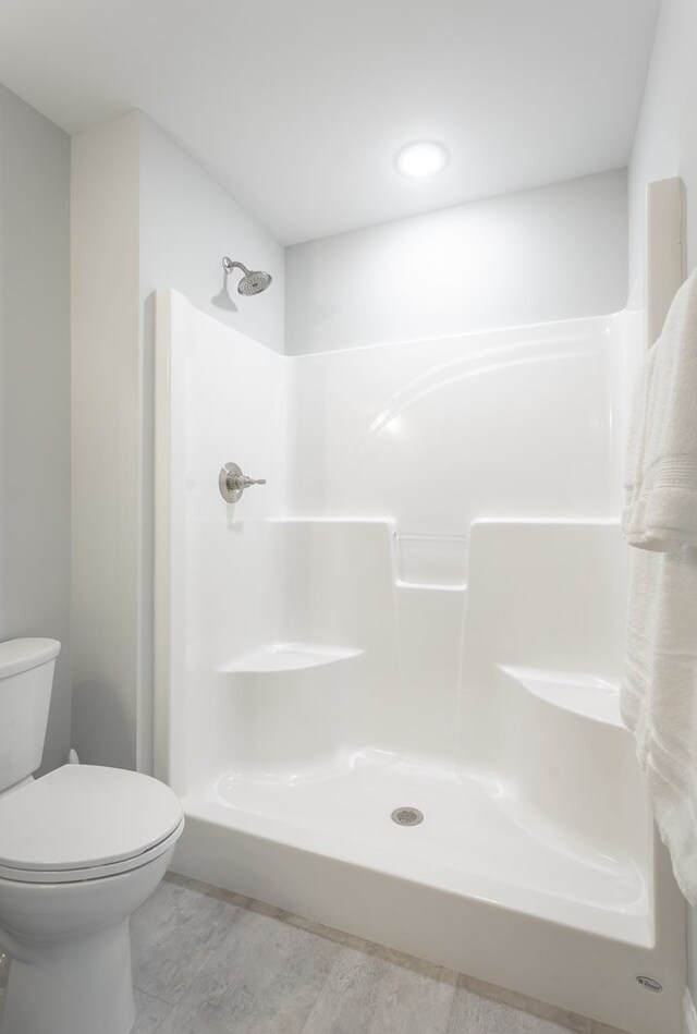 141 Andros Dr, Dalton, GA 30721 - bathroom featuring toilet and a shower