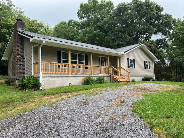 830 Chattanooga Rd, Cohutta, GA 30710 - ranch-style house with a porch, a chimney, a metal roof, and driveway