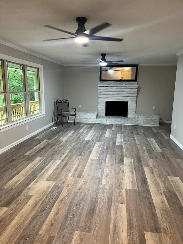 830 Chattanooga Rd, Cohutta, GA 30710 - unfurnished living room with crown molding, a ceiling fan, a brick fireplace, and wood finished floors