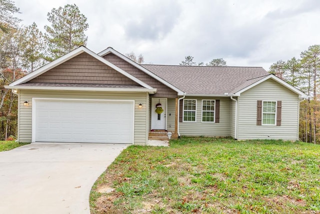 ranch-style home with a garage and a front lawn