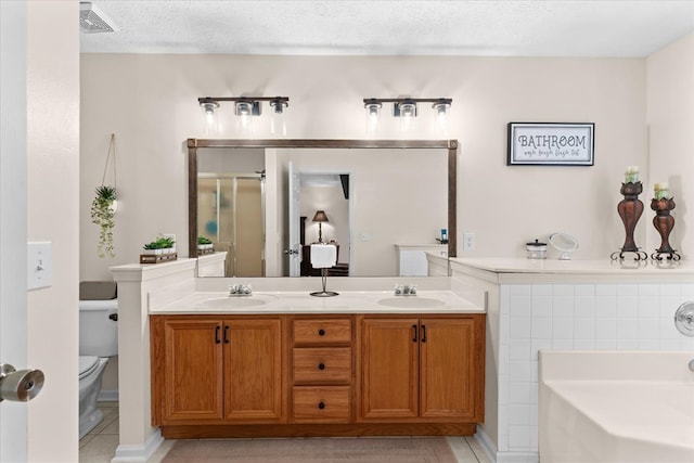 217 Valley Rd, Chatsworth, GA 30705 - full bath with a bath, tile patterned flooring, double vanity, a textured ceiling, and a stall shower
