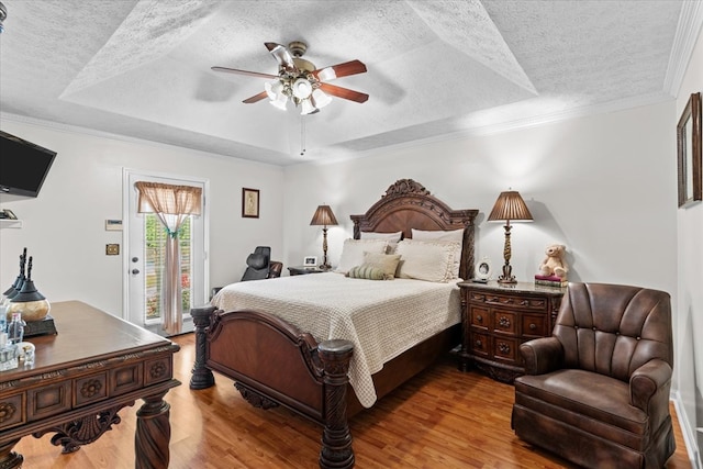 217 Valley Rd, Chatsworth, GA 30705 - bedroom with a raised ceiling, a textured ceiling, access to outside, wood finished floors, and a ceiling fan