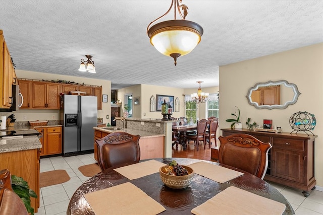 217 Valley Rd, Chatsworth, GA 30705 - dining room with a chandelier, light tile patterned flooring, and a textured ceiling