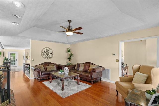 217 Valley Rd, Chatsworth, GA 30705 - living room featuring a raised ceiling, a ceiling fan, wood finished floors, and a textured ceiling