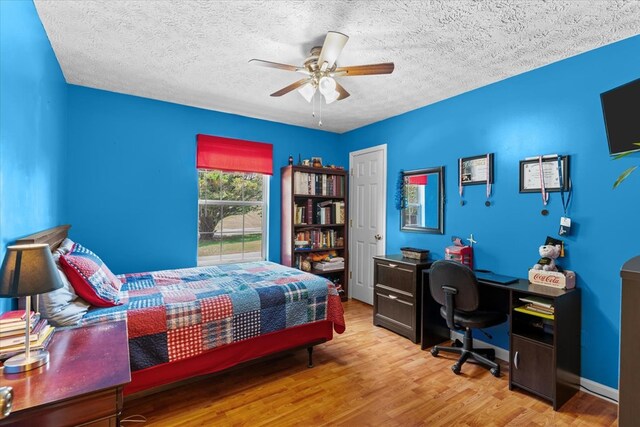 217 Valley Rd, Chatsworth, GA 30705 - bedroom featuring a desk, wood finished floors, a textured ceiling, and a ceiling fan