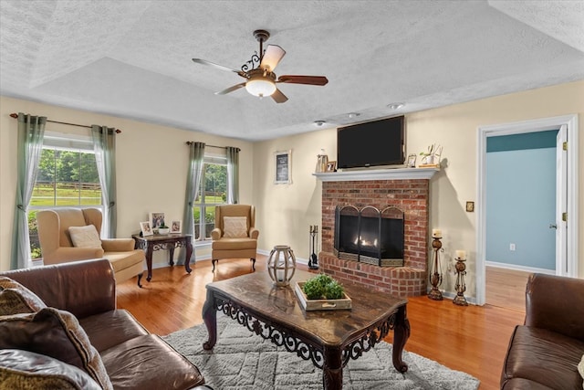 217 Valley Rd, Chatsworth, GA 30705 - living area featuring a textured ceiling, plenty of natural light, a ceiling fan, and wood finished floors