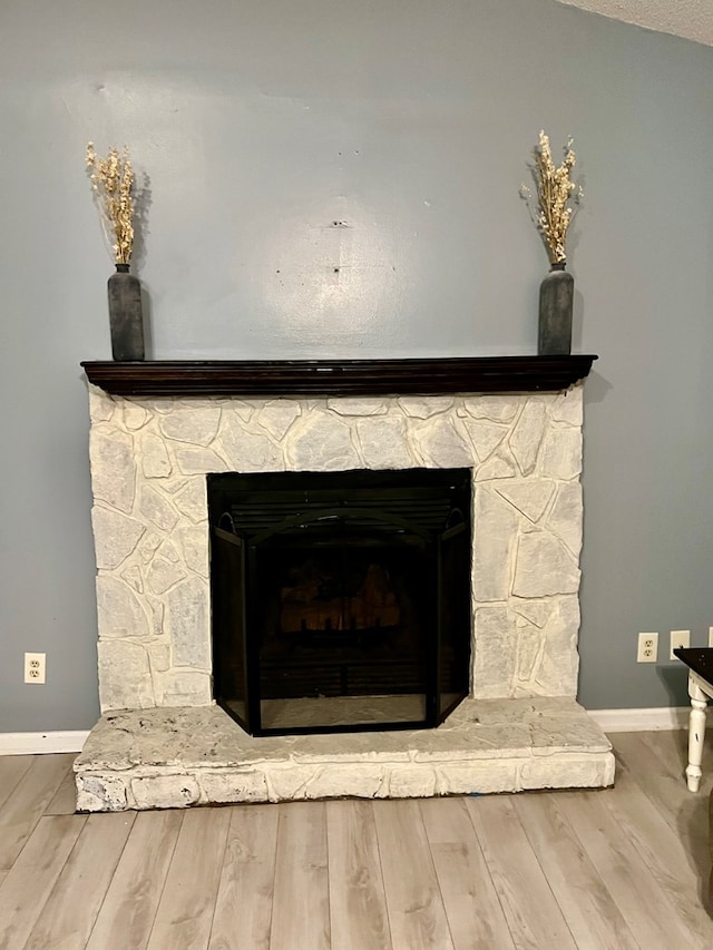 4781 Treetop Ln, Cohutta, GA 30710 - interior details featuring wood finished floors, baseboards, and a stone fireplace