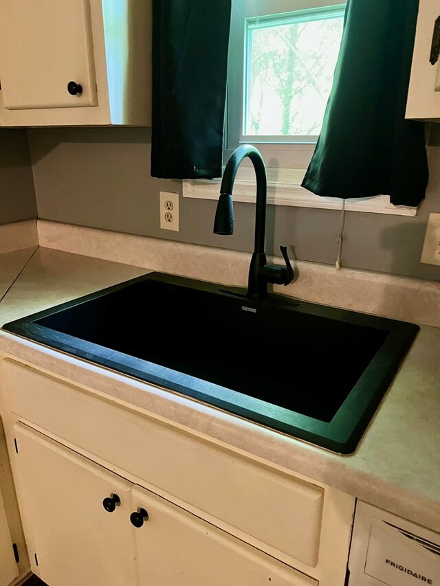4781 Treetop Ln, Cohutta, GA 30710 - interior details with white cabinets, light countertops, and a sink