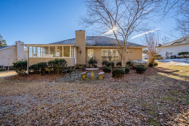 back of property featuring a sunroom