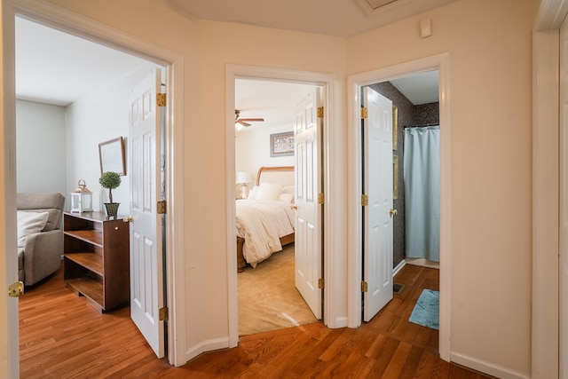 hallway featuring hardwood / wood-style flooring