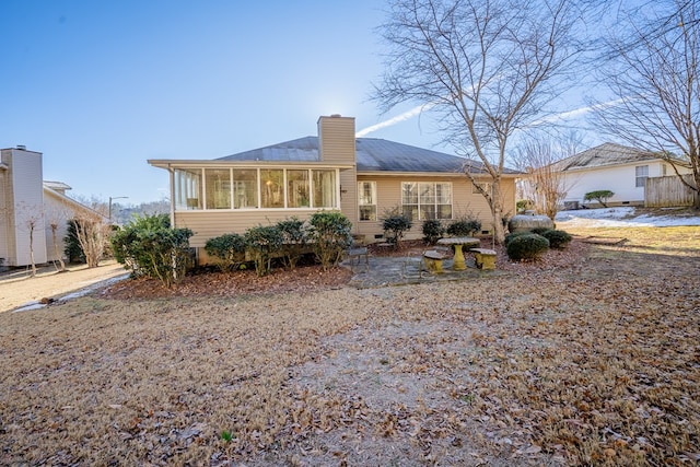 back of property featuring a sunroom