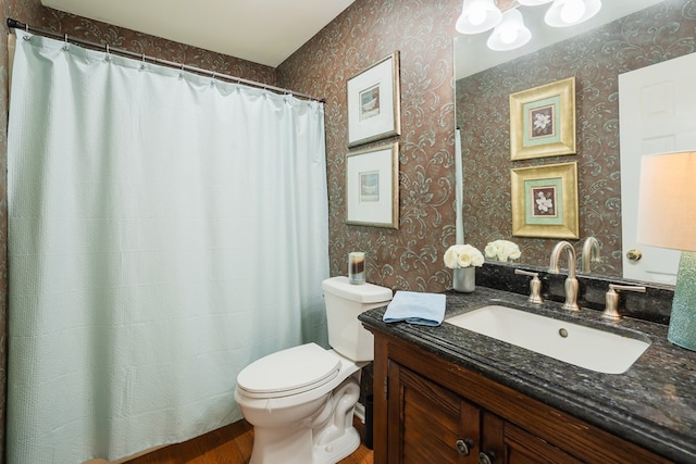 bathroom with vanity and toilet