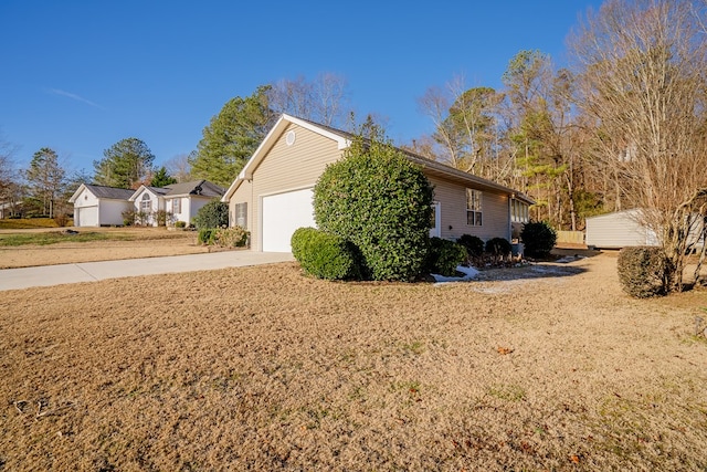 view of home's exterior featuring a garage and a lawn