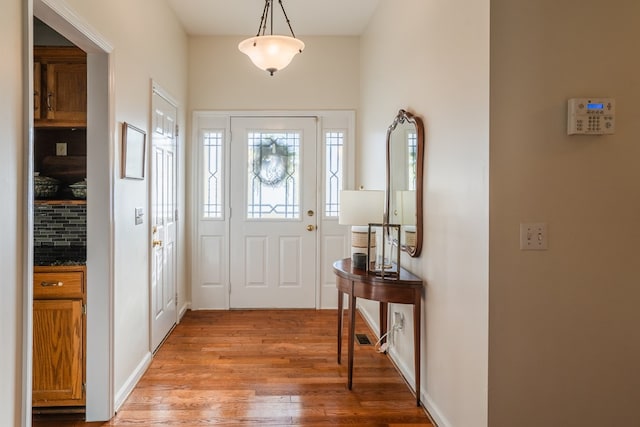 doorway to outside featuring light hardwood / wood-style flooring