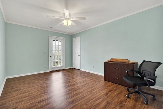 office area with visible vents, dark wood-type flooring, a ceiling fan, crown molding, and baseboards