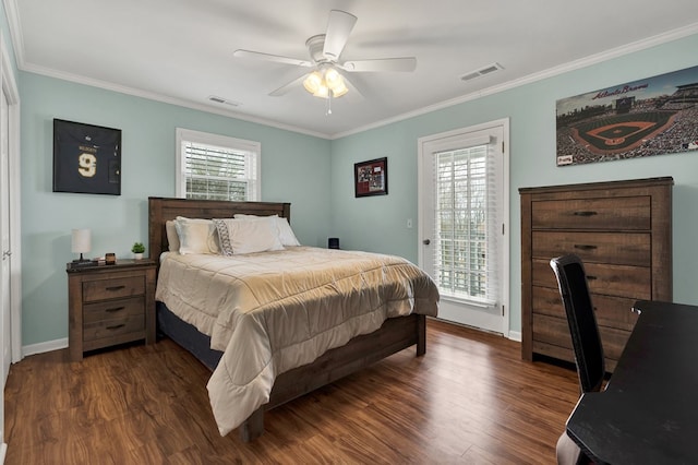 bedroom with dark wood finished floors, visible vents, crown molding, and access to outside