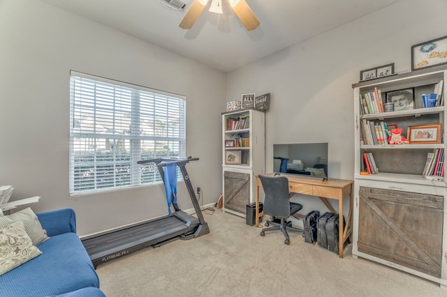 office space featuring a ceiling fan, visible vents, carpet floors, and baseboards