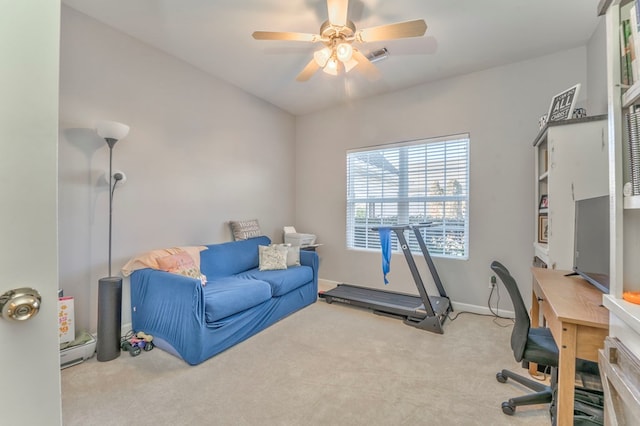 carpeted office with baseboards, visible vents, and ceiling fan