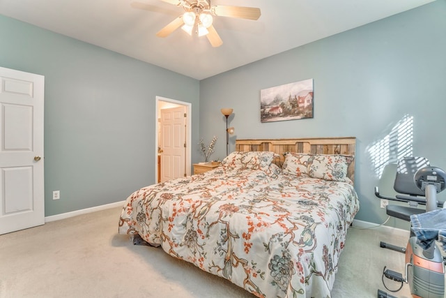 carpeted bedroom with a ceiling fan and baseboards