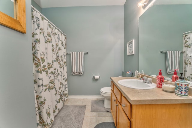 bathroom with tile patterned floors, toilet, a shower with shower curtain, baseboards, and vanity