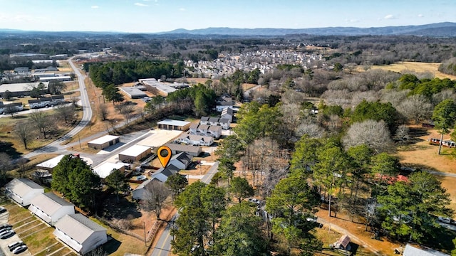 birds eye view of property with a mountain view