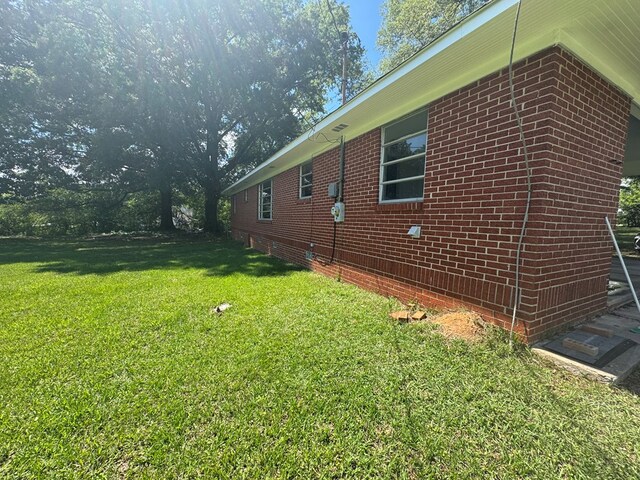 320 Mitchell Bridge Rd, Chatsworth, GA 30705 - view of property exterior with a lawn and brick siding