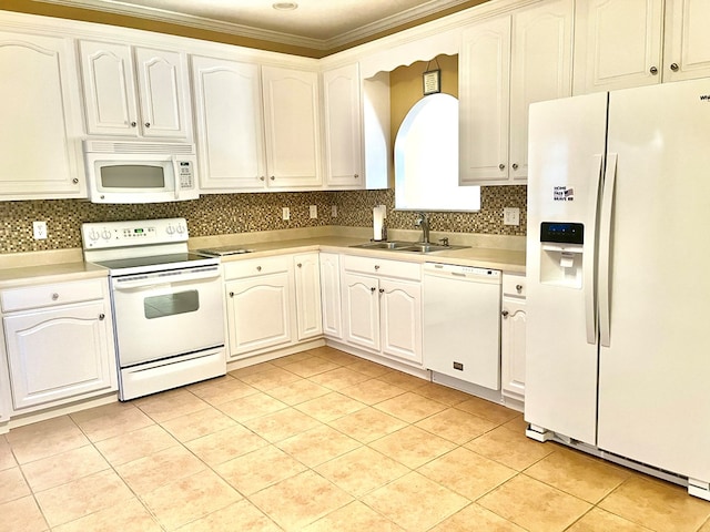 kitchen with light tile patterned flooring, sink, white cabinets, white appliances, and backsplash