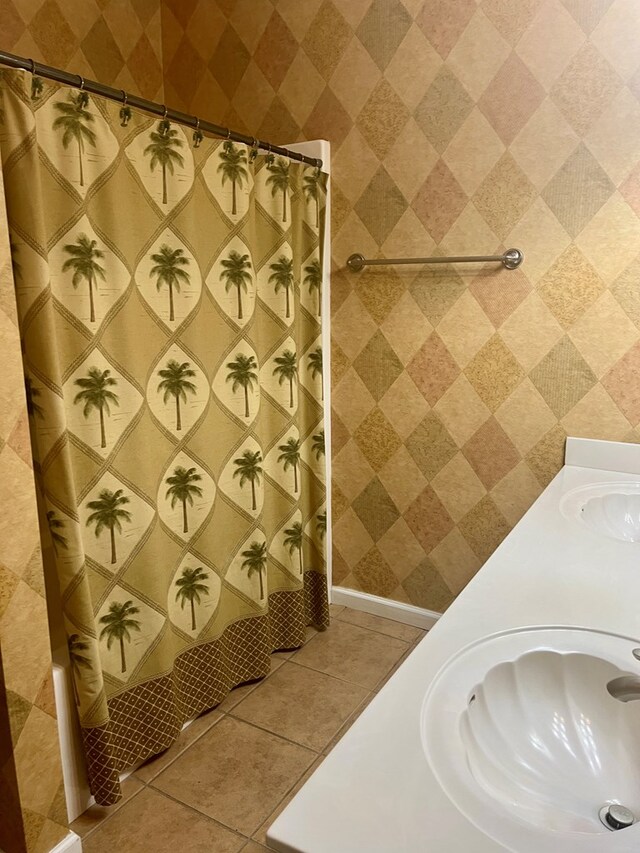 bathroom with tile patterned flooring, vanity, and a shower with shower curtain
