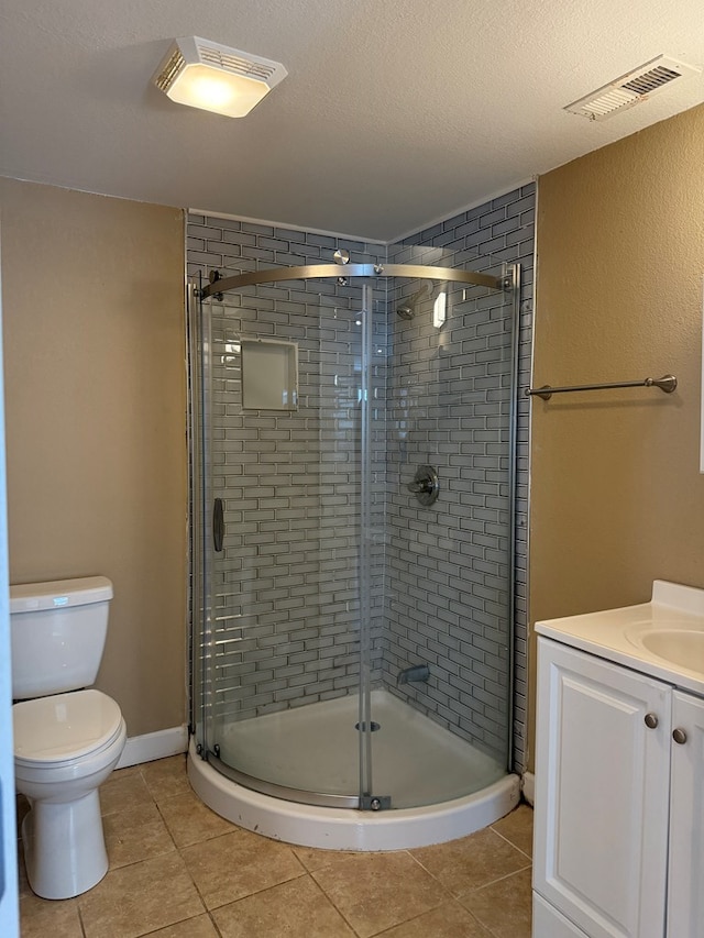 506 Teasley St, Dalton, GA 30721 - bathroom featuring toilet, a shower stall, tile patterned floors, vanity, and a textured ceiling